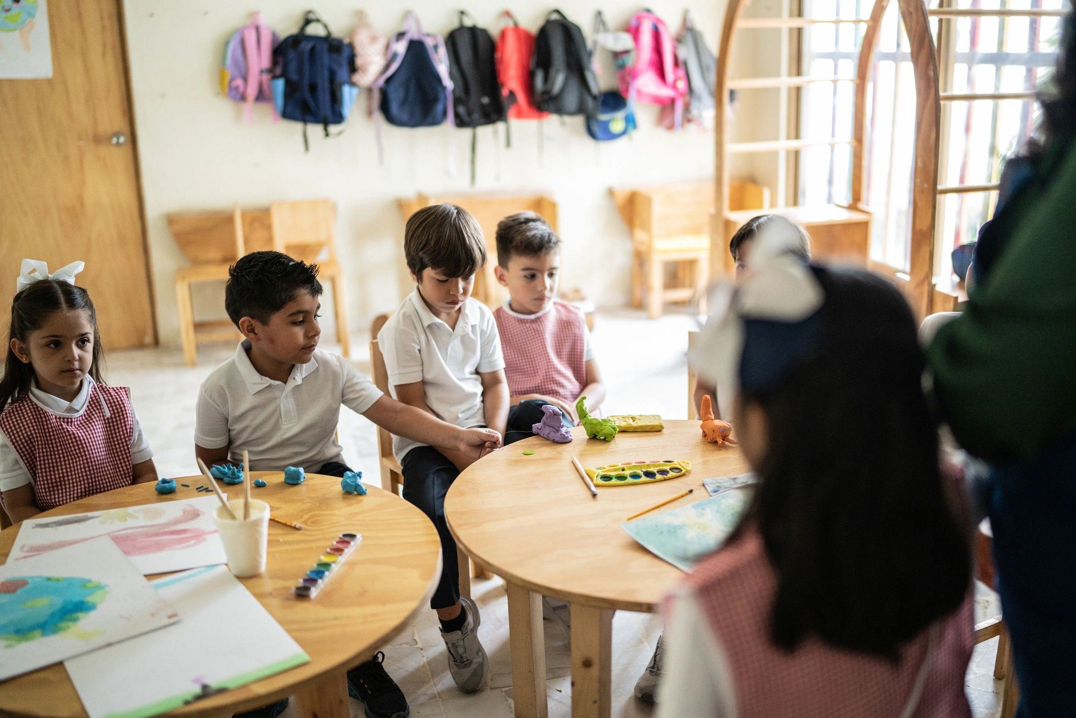 Parent smiling in a classroom setting