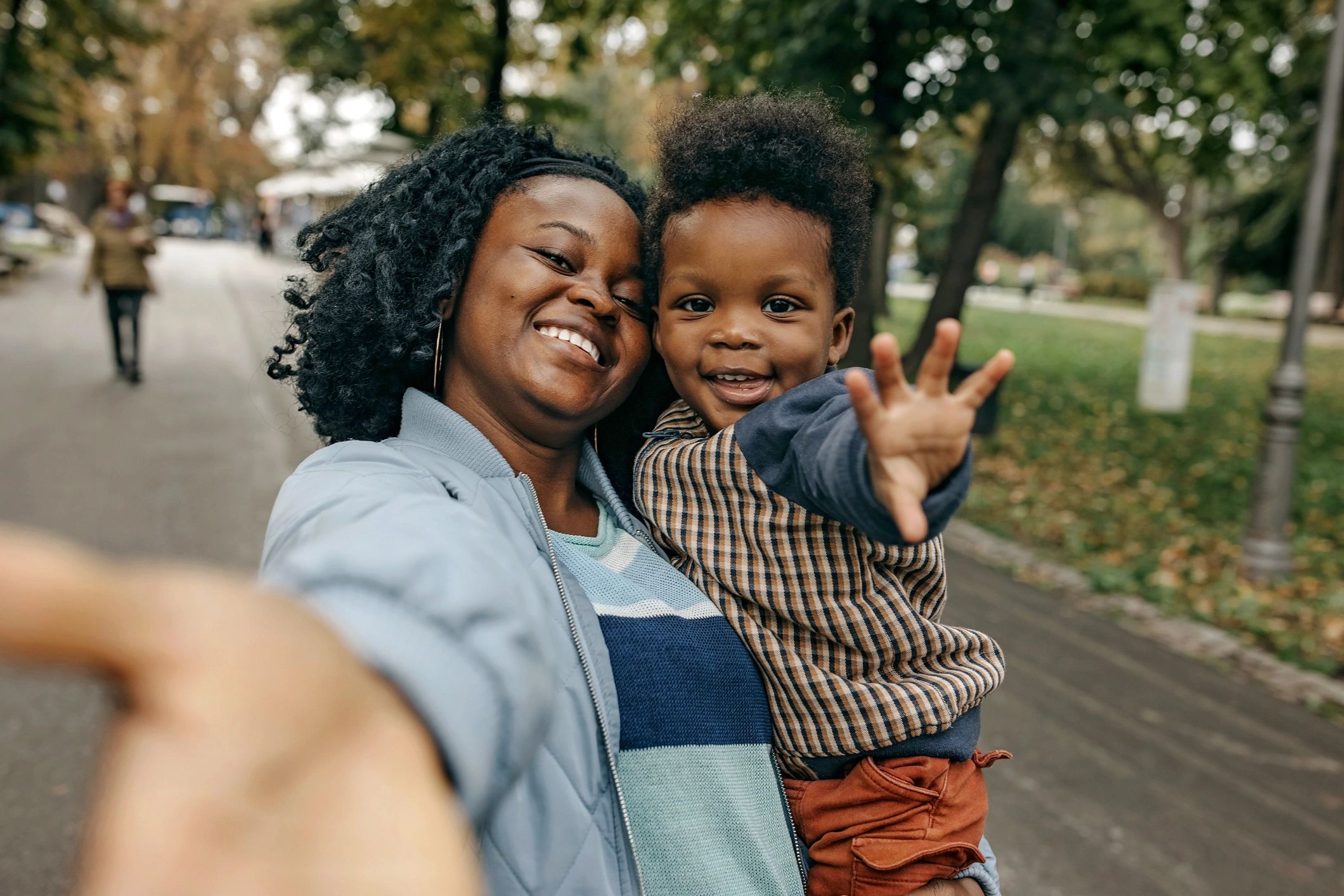 Parent and child hugging, smiling together